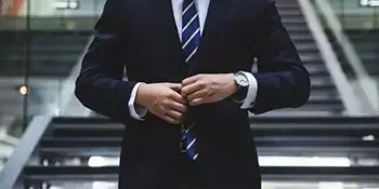 Business man walking with a suit